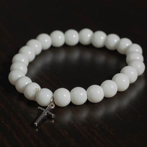 White beaded cross bracelet